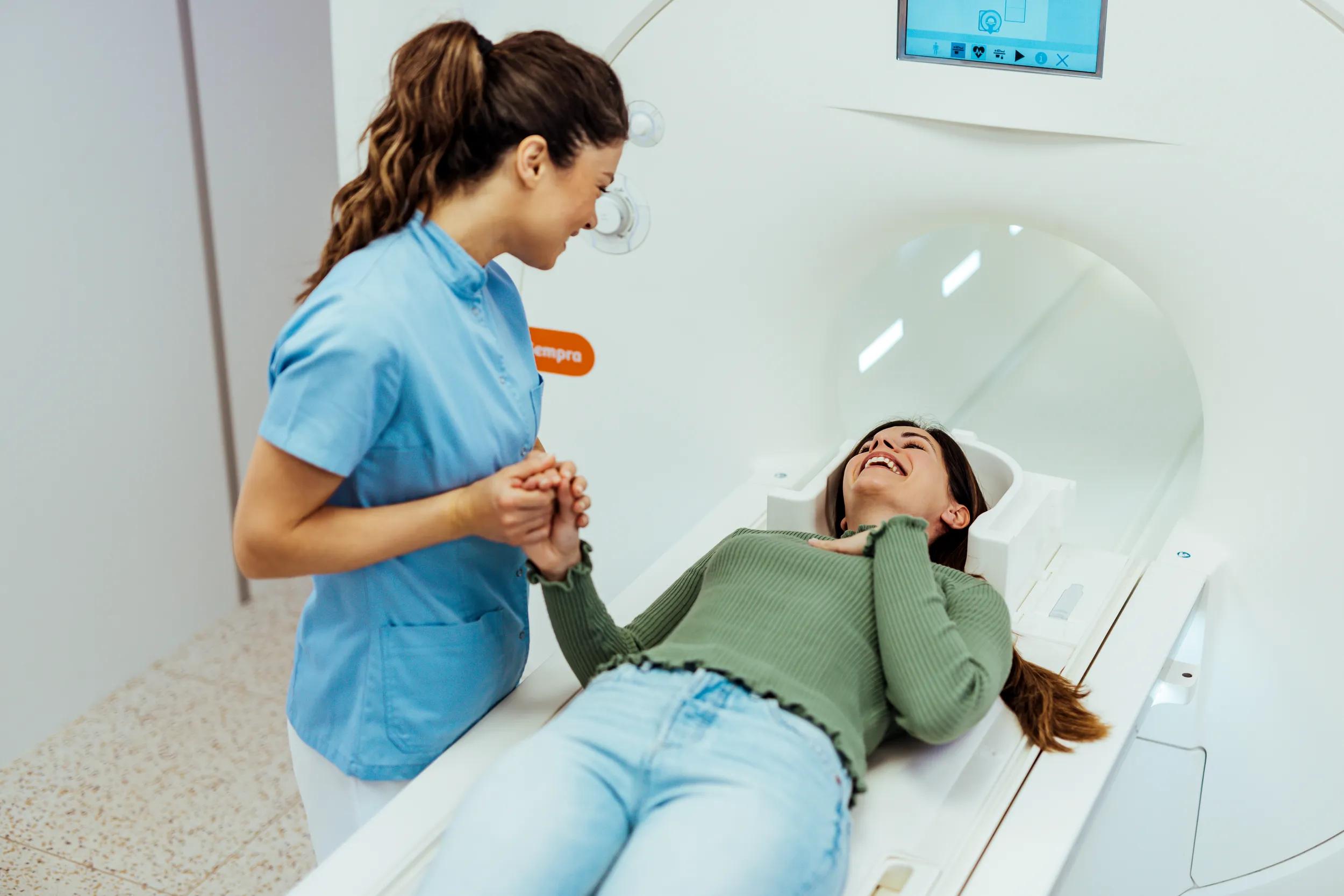 Friendly Nurse Assisting Patient During Advanced Medical Imaging Procedure