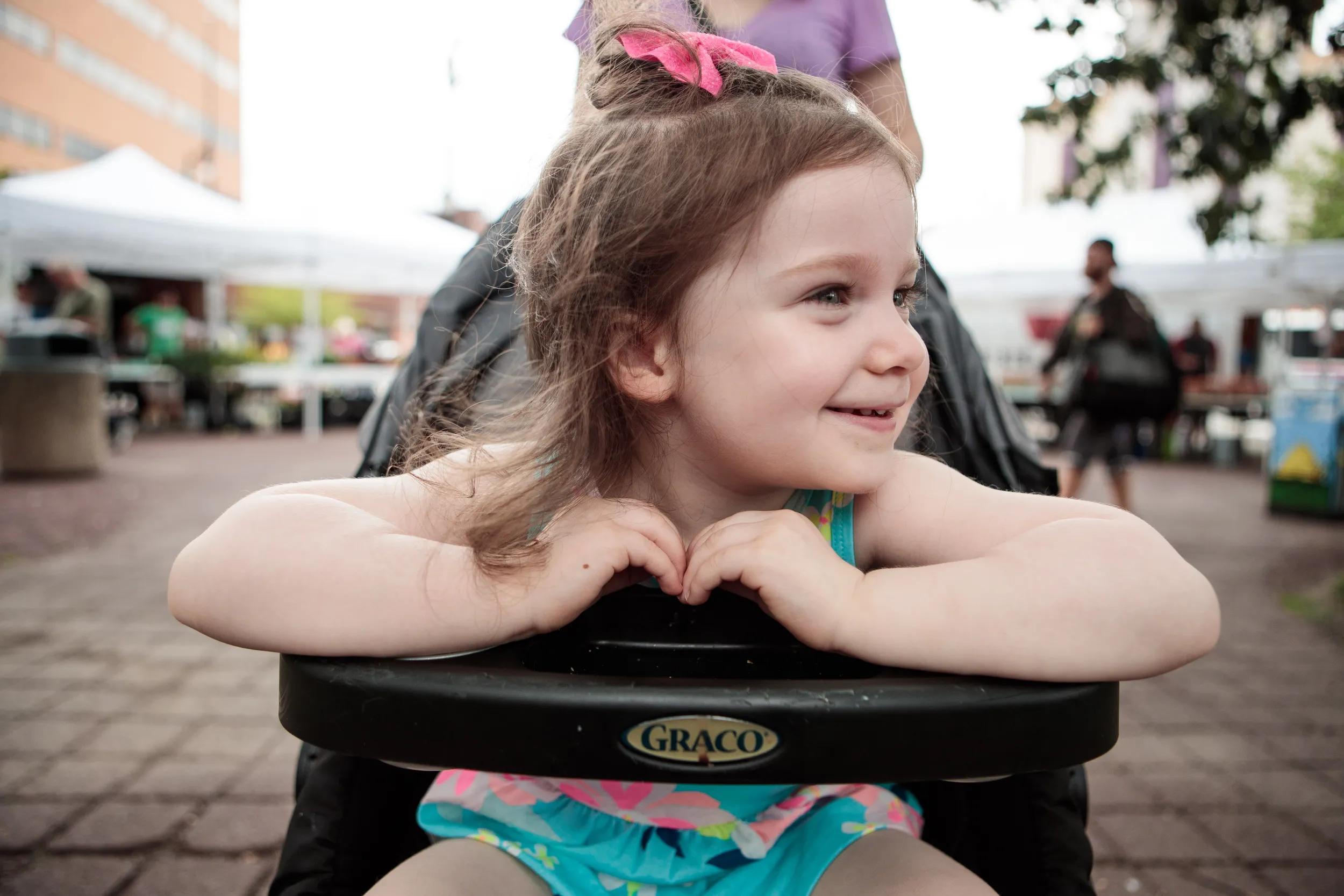 Little girl in stroller 14
