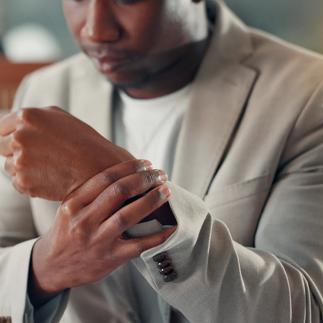 Businessman, wrist pain and laptop with tension for night, pressure or office injury. Hands, person and consultant stress with tech for burnout, deadline or fatigue for compliance officer
