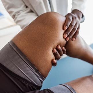 Performing the anterior drawer test in left knee