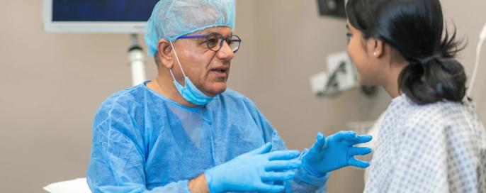 Hospital patient discusses with doctor