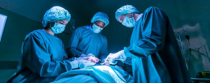 Team of surgeon doctors are performing heart surgery operation for patient from organ donor to save more life in emergency surgical room