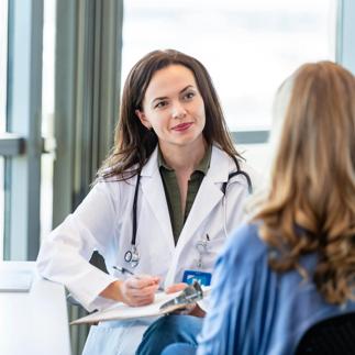 Attentive doctor listens to patient's symptoms