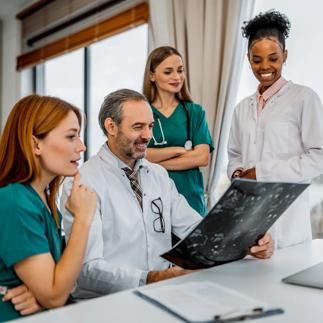 Medical team collaborating on diagnostic imaging for patient care