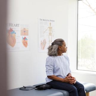 Female patient gazes out the window while waiting for the cardiologist