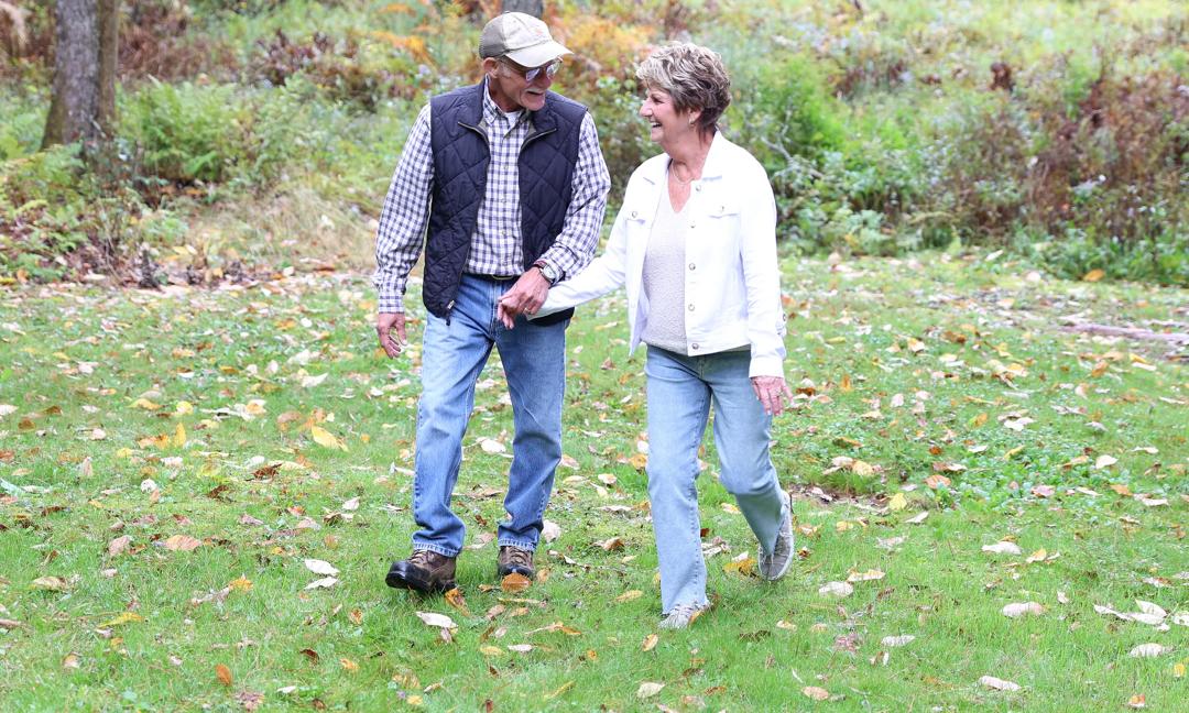 Michael Gill walking with wife