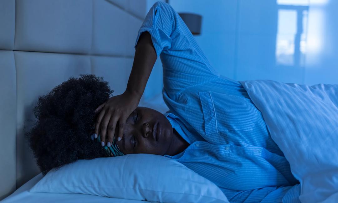 Sad woman suffering  while layin in bed at night
