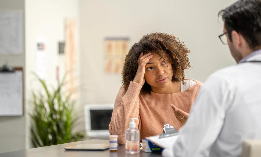 Female Adult Feeling Sad at a Medical Appointment