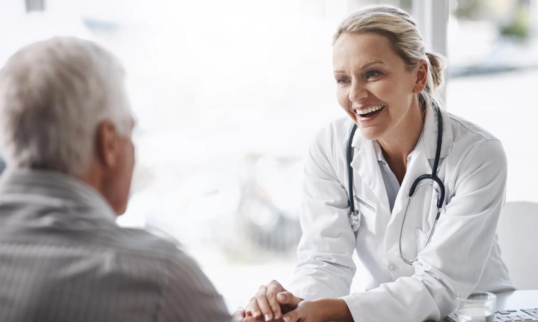 Cropped shot of a mature female doctor working with a senior male patient in her office in the hospital