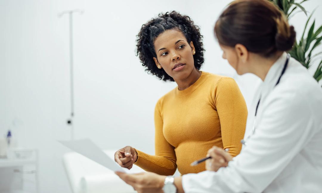 Woman and discussing about medical treatment at private practice medical office.