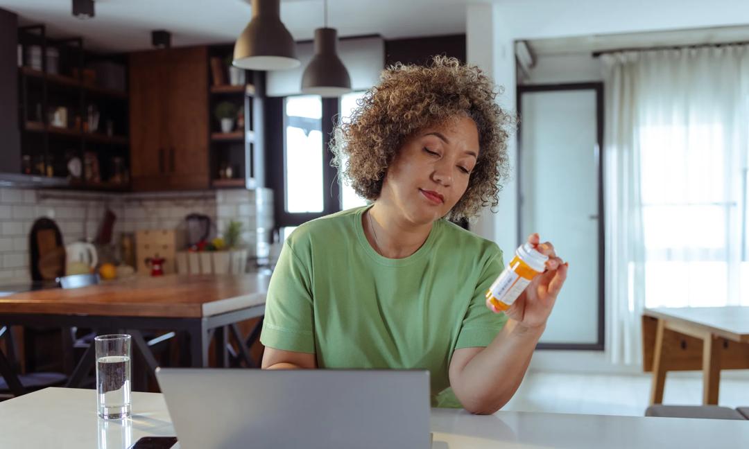 Mature woman is reading information's about medicine on the internet