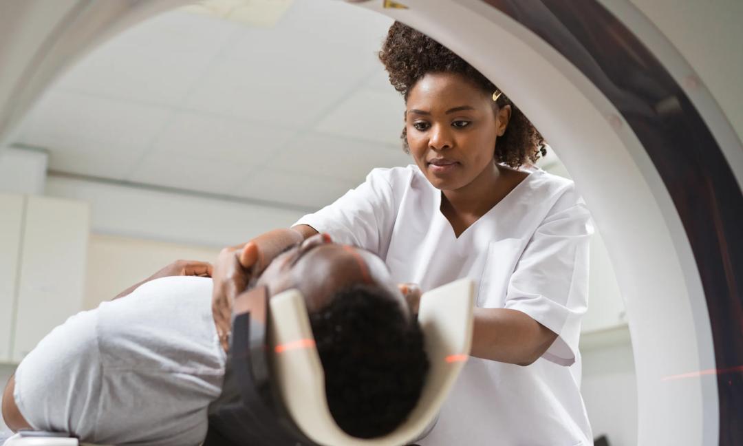Male patient undergoing MRI scan in medical examination room