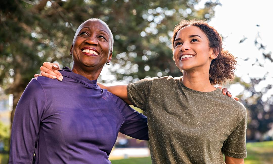 Senior Black woman with her granddaughter outdoors