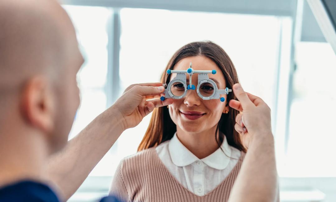 Optometrist Conducting Vision Test with Patient Using Precision Measurement Device