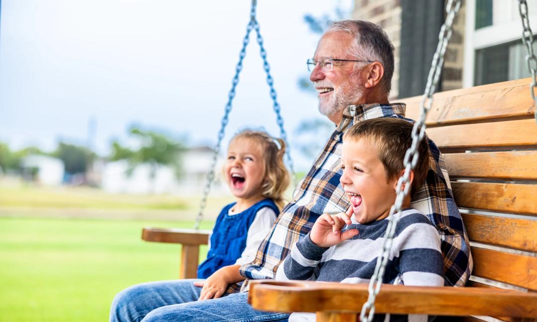 Fun story time with grandpa on the porch swing