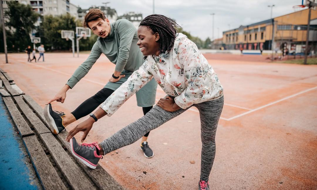 Friends do warm-up exercises
