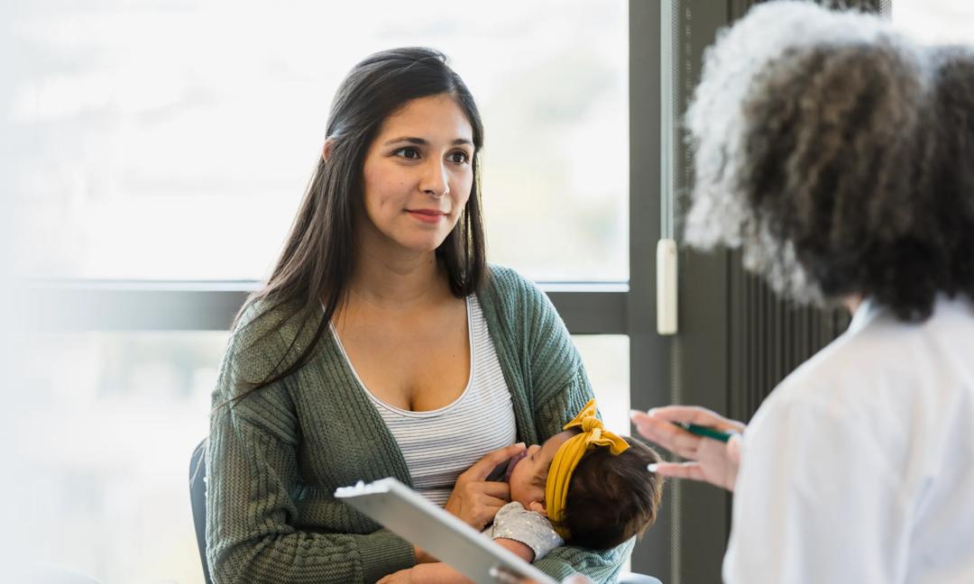 Mother and Baby Consultation with Doctor at Clinic