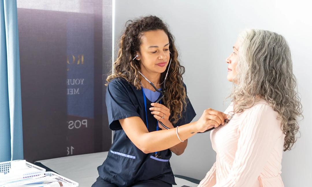 Mature age woman meets with general practitioner for a yearly check up