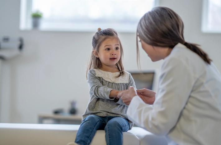 Female Doctor with a Young Patient