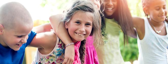 Five happy children in summer