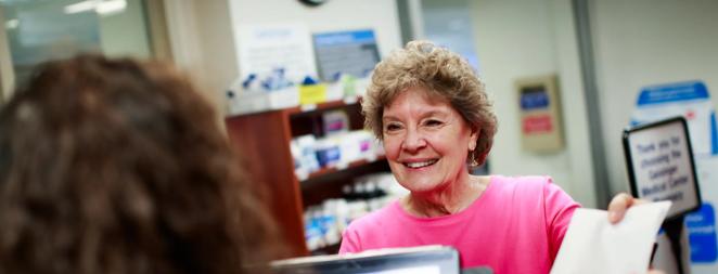 Lois Baylor, Patient (in pink shirt)
Micaela Mitchell, Pharmacy Manager (GMC)
Picking up prescription
Pharmacy
