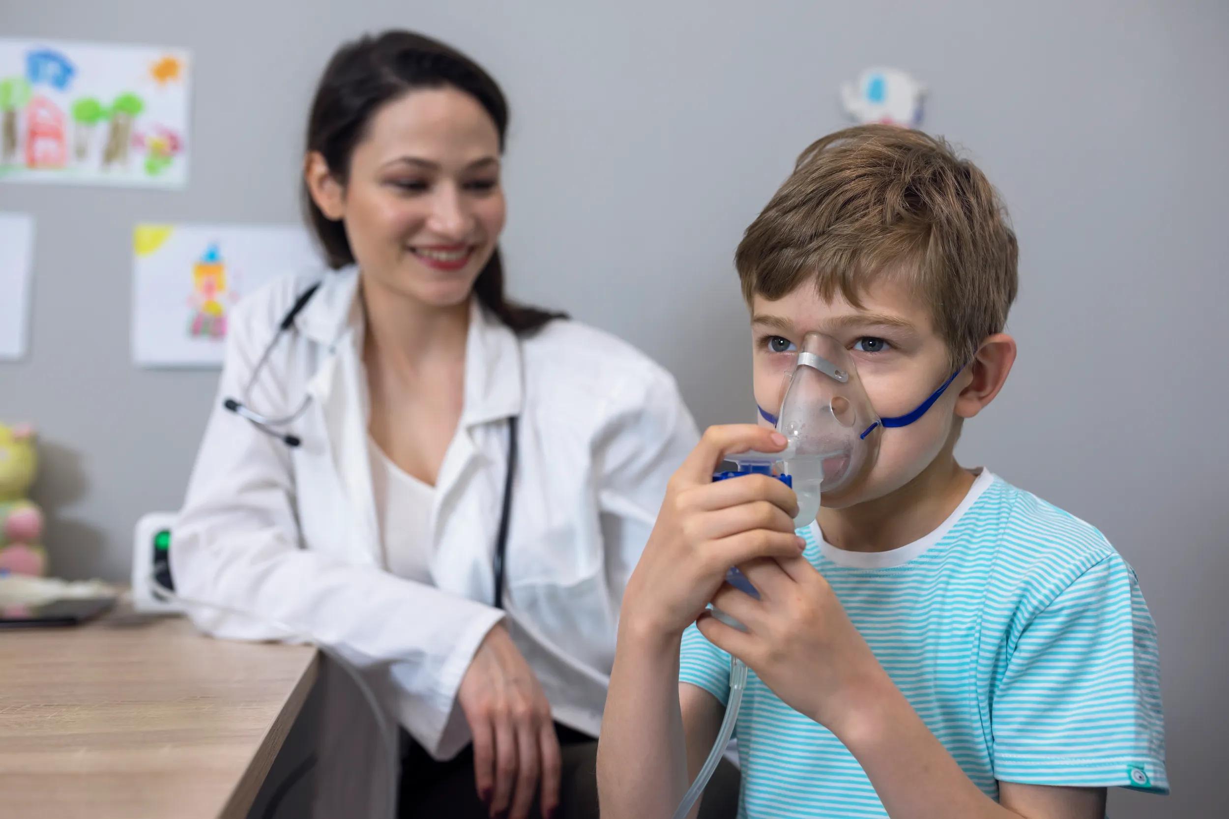 Doctor and kid on pediatrician clinic