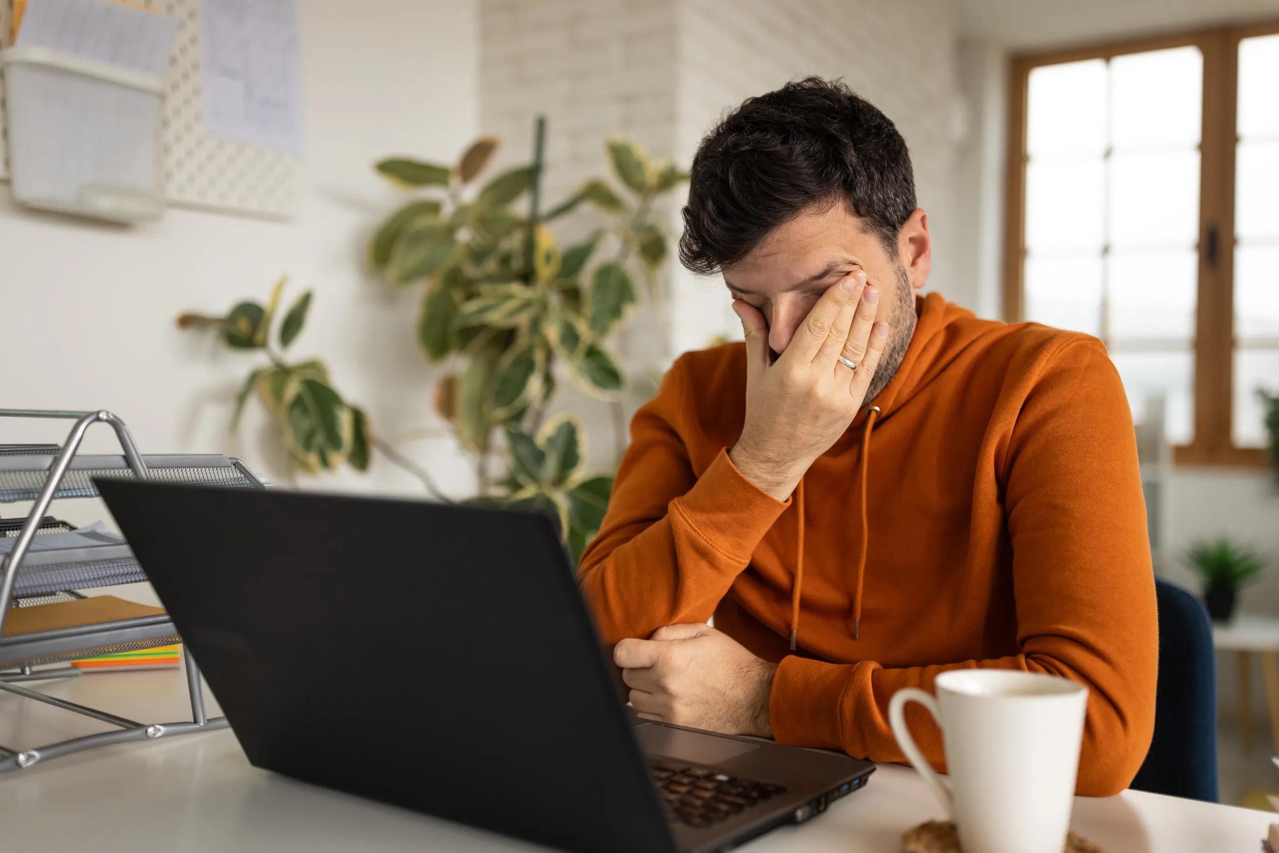 Man tired after working at home