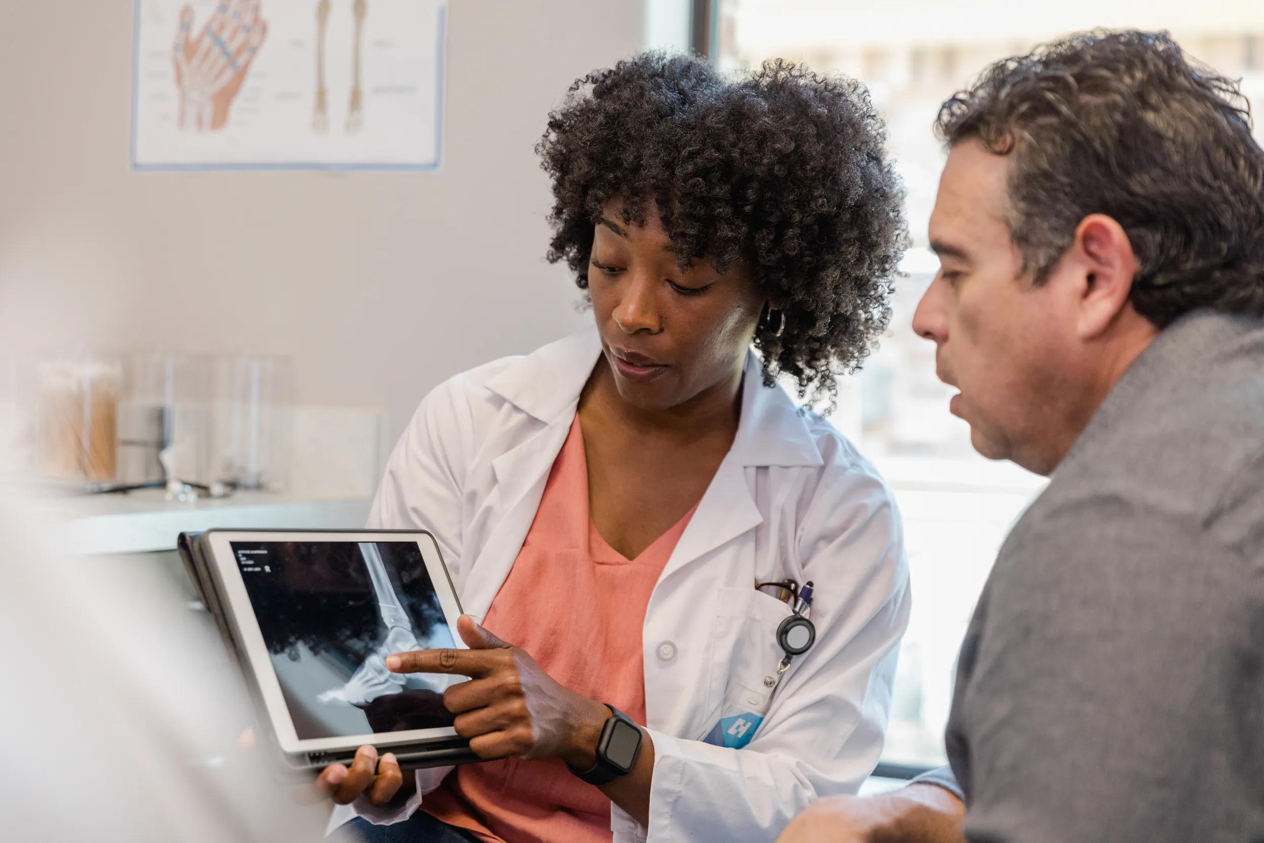 Nurse points out a concerning spot on the x-ray