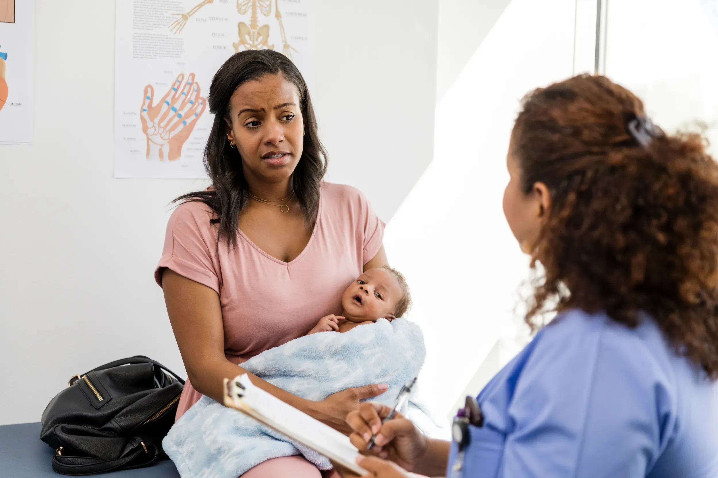 Worried Mother with Baby at Doctor's Office